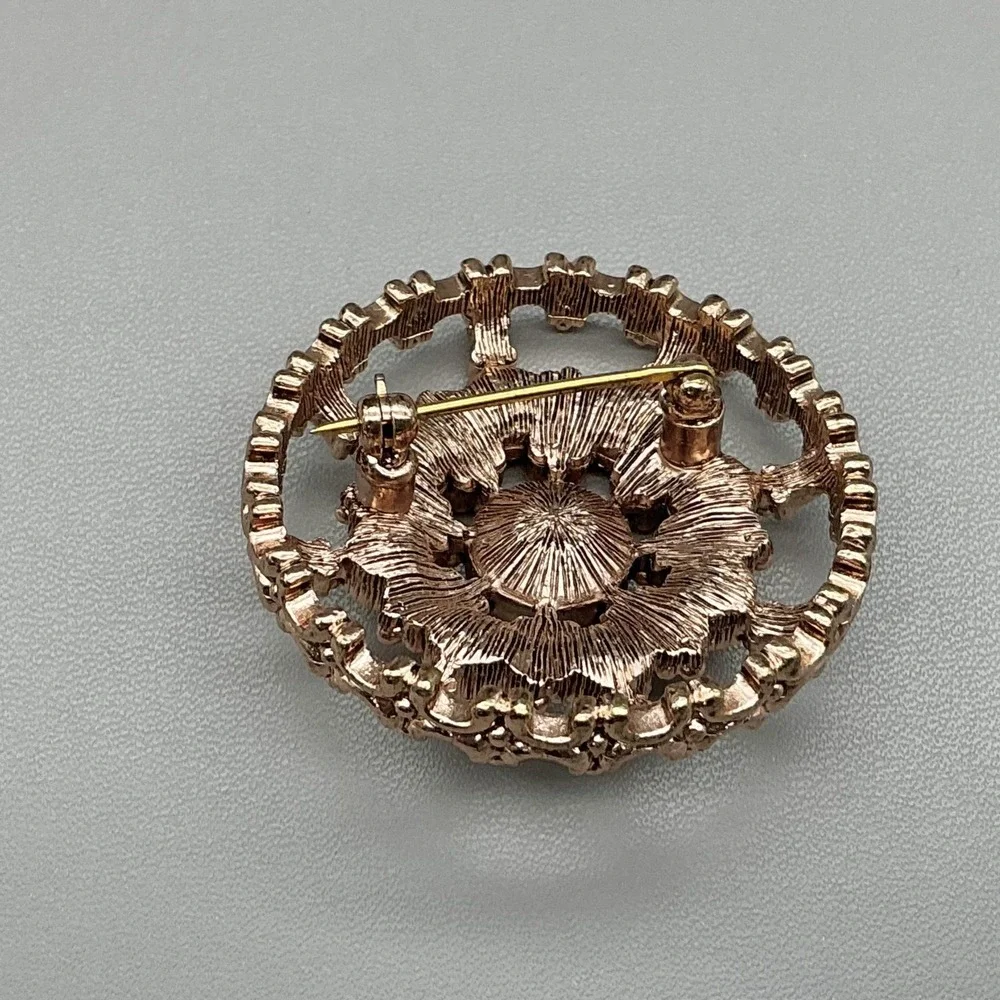 Gold Tone Pink Rhinestone Flower Brooch Pin Round Openwork Costume Jewelry